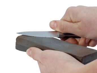 sharpening-knife-on-oilstone-260nw-22750705.jpg